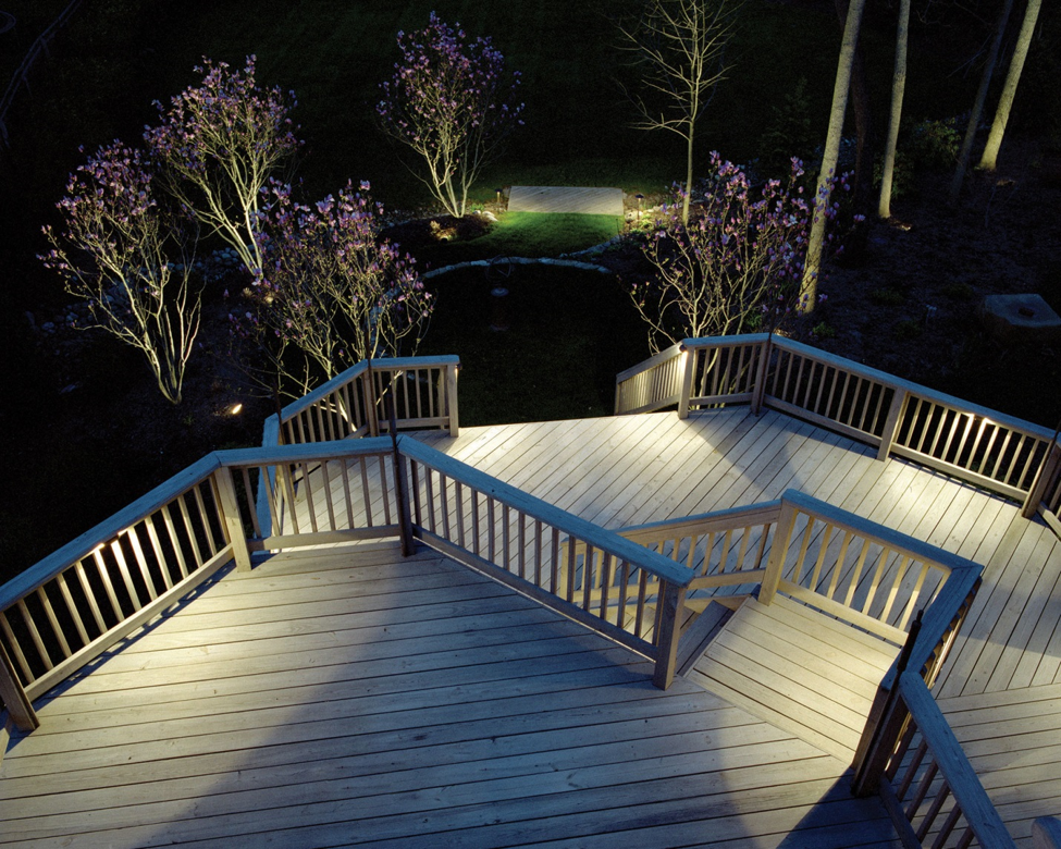 deck lighting surrounded by trees 