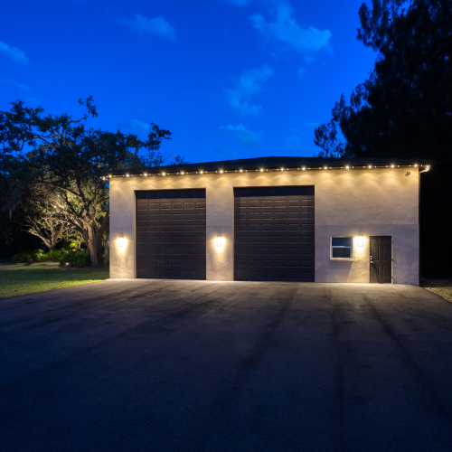 A garage with lights on the side

Description automatically generated