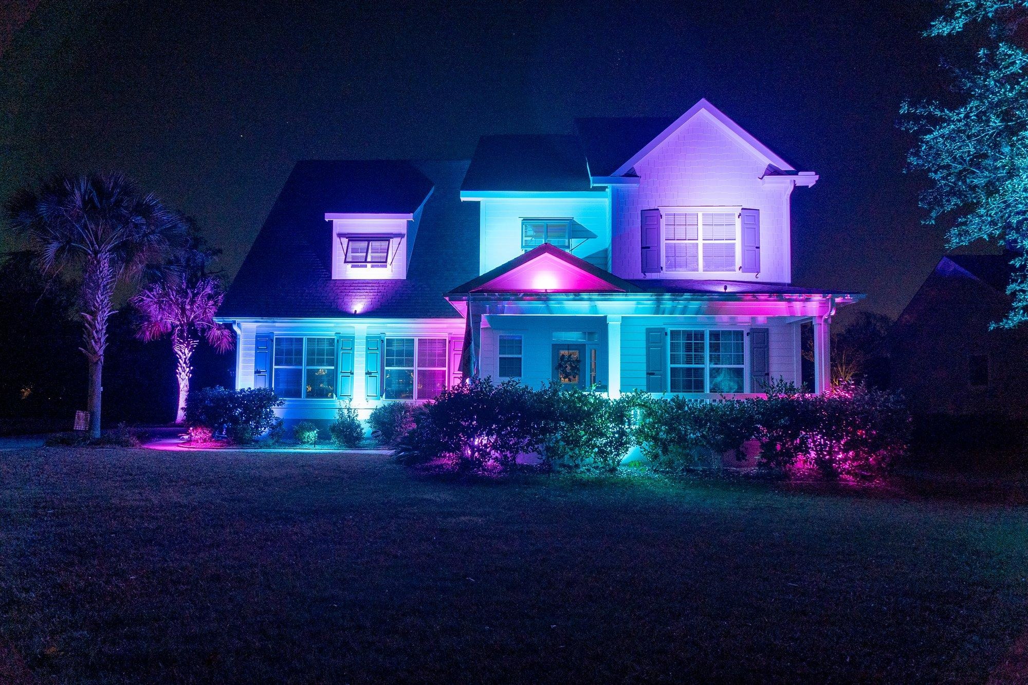 Charleston home washed in vibrant multicolor light from permanent color-changing landscape fixtures