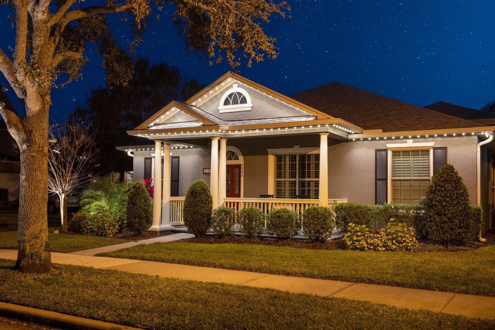 Orlando home with permanent roofline lighting in elegant warm white