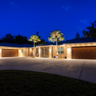 Add architectural beauty at night with permanent track lighting for your home. Photo