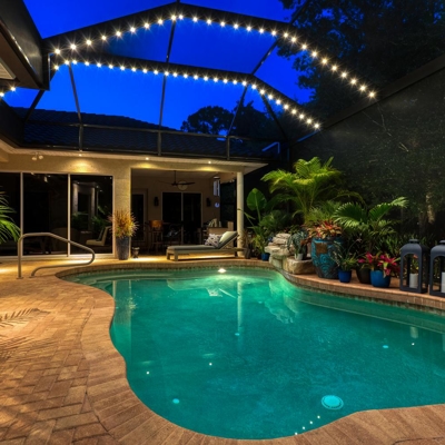 Warm white lighting option with permanent track lighting over the pool. Photo