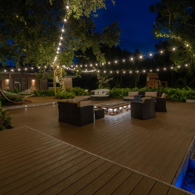 Impress your friends with outdoor lighting for your deck and backyard by adding bistro lighting to c Photo