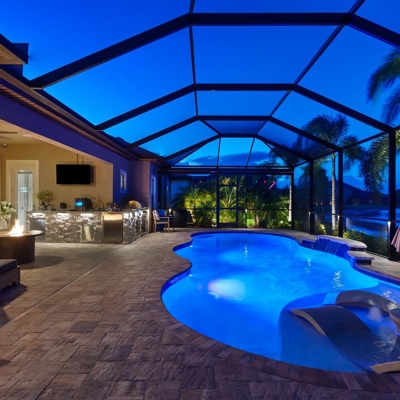 Add ambiance to your Florida lanai with professional landscape lighting and deck lighting. Photo