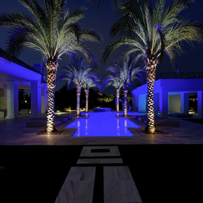 Add landscape lighting around your pool for nighttime ambiance in Miami Beach.   Photo