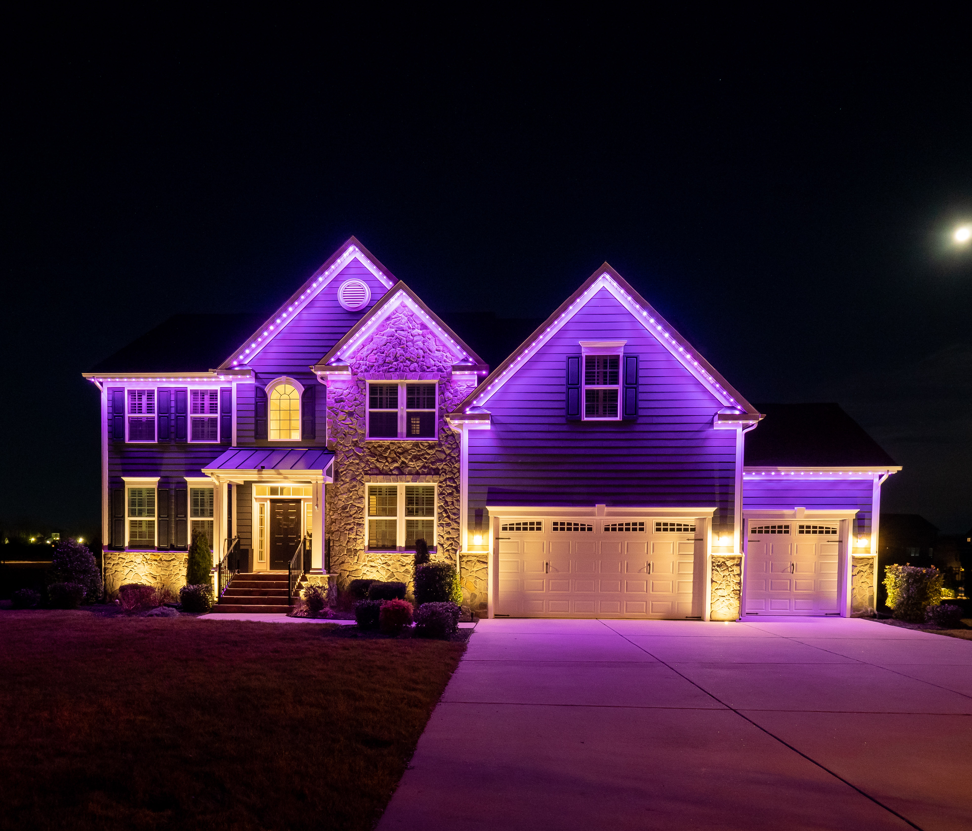 Purple permanent roofline lighting