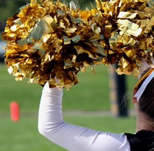 Cheerleader with pompoms 
