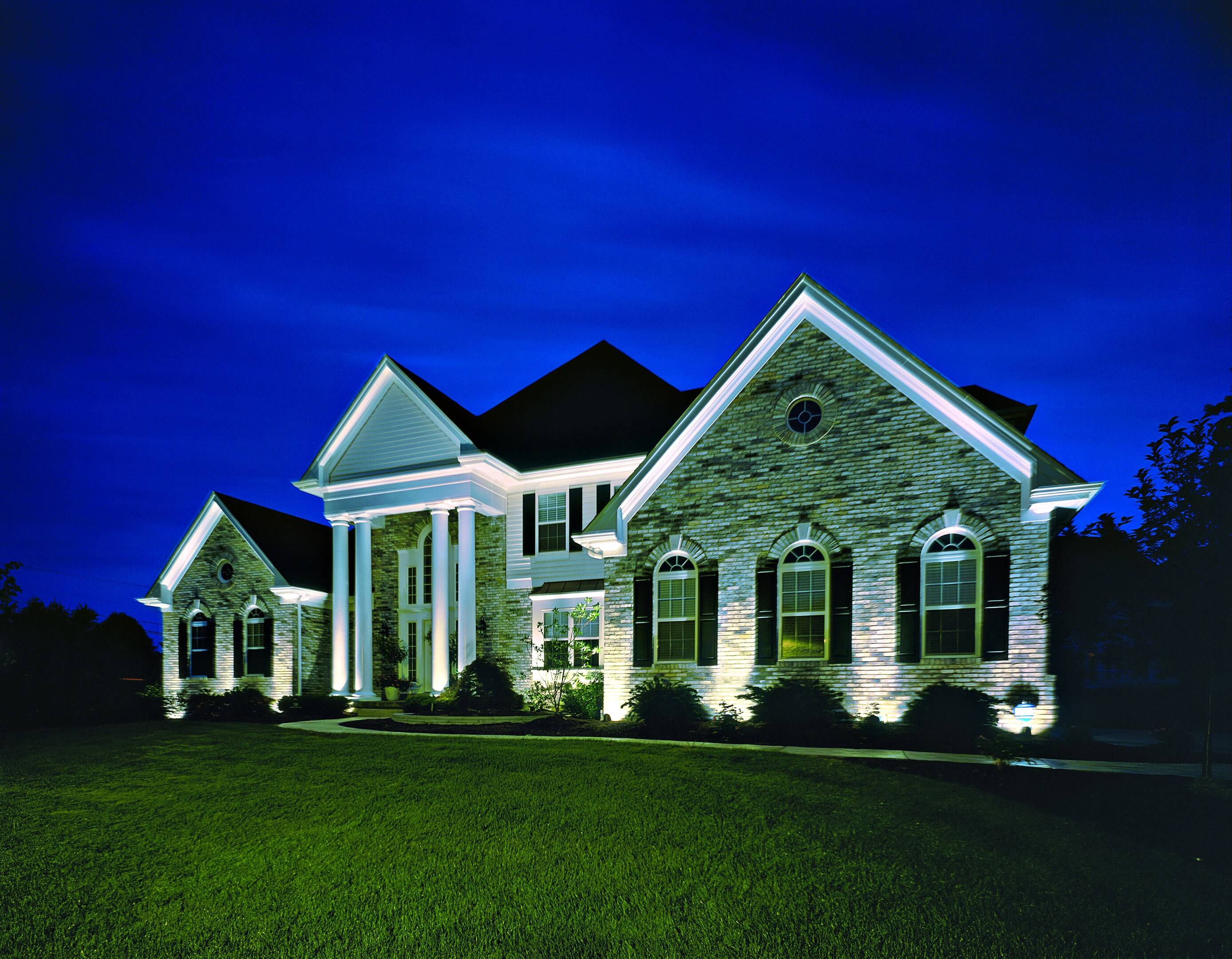 house with exterior lighting at night