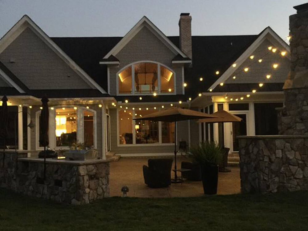 House with backyard string lighting
