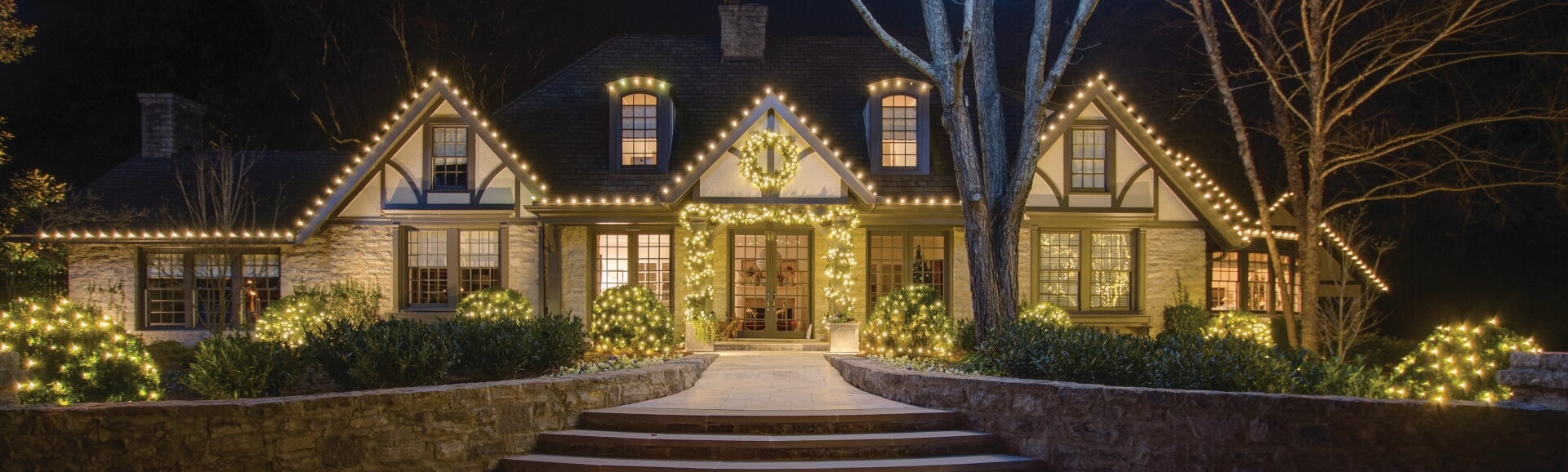 rochester home decorated with holiday lighting