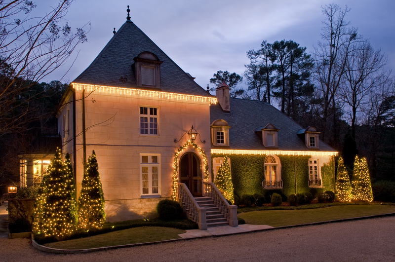 Christmas lights lighting up a house