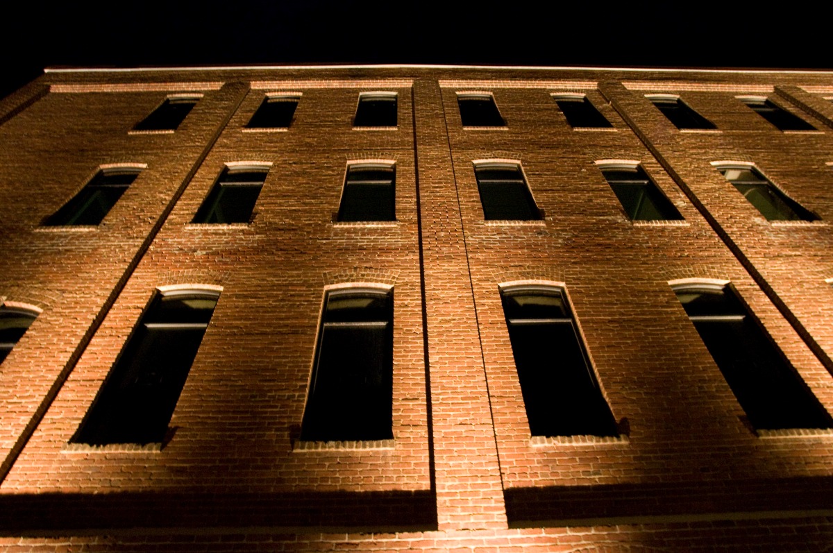 Illuminated windows on the side of a building