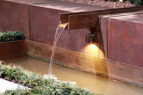water feature with light fixture 