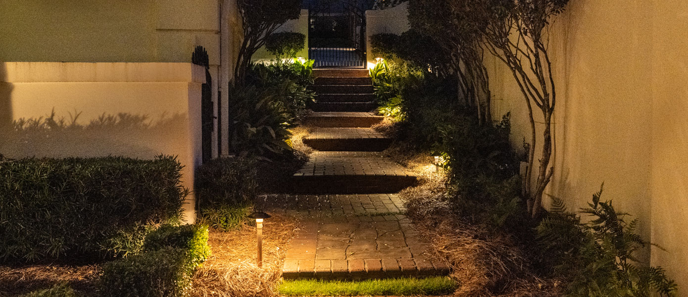 small alley sidewalk with steps and pathway lighting