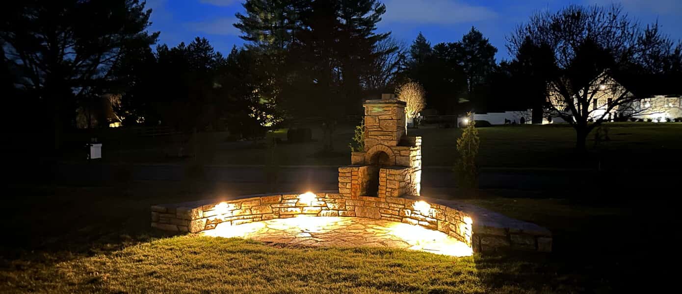 A stone wall with lights on