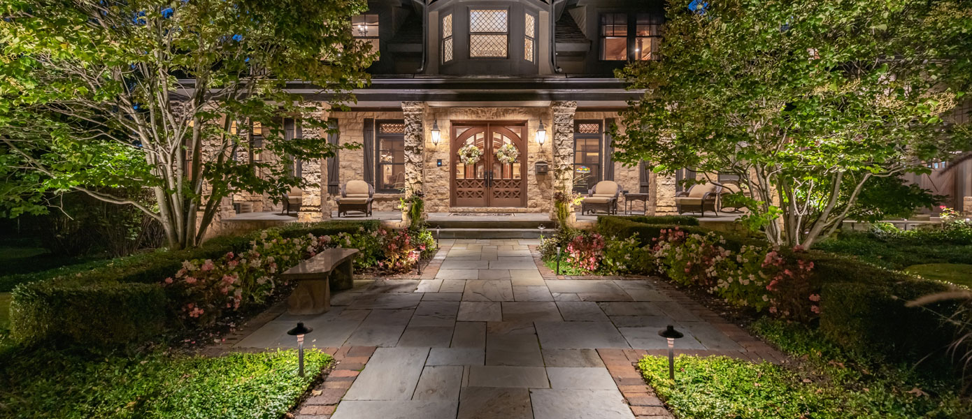 front porch with outdoor landscape lighting
