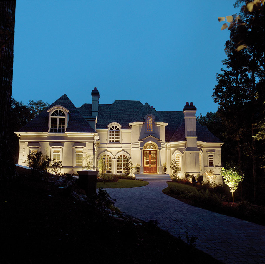 Home in the Woodlands with landscape lighting