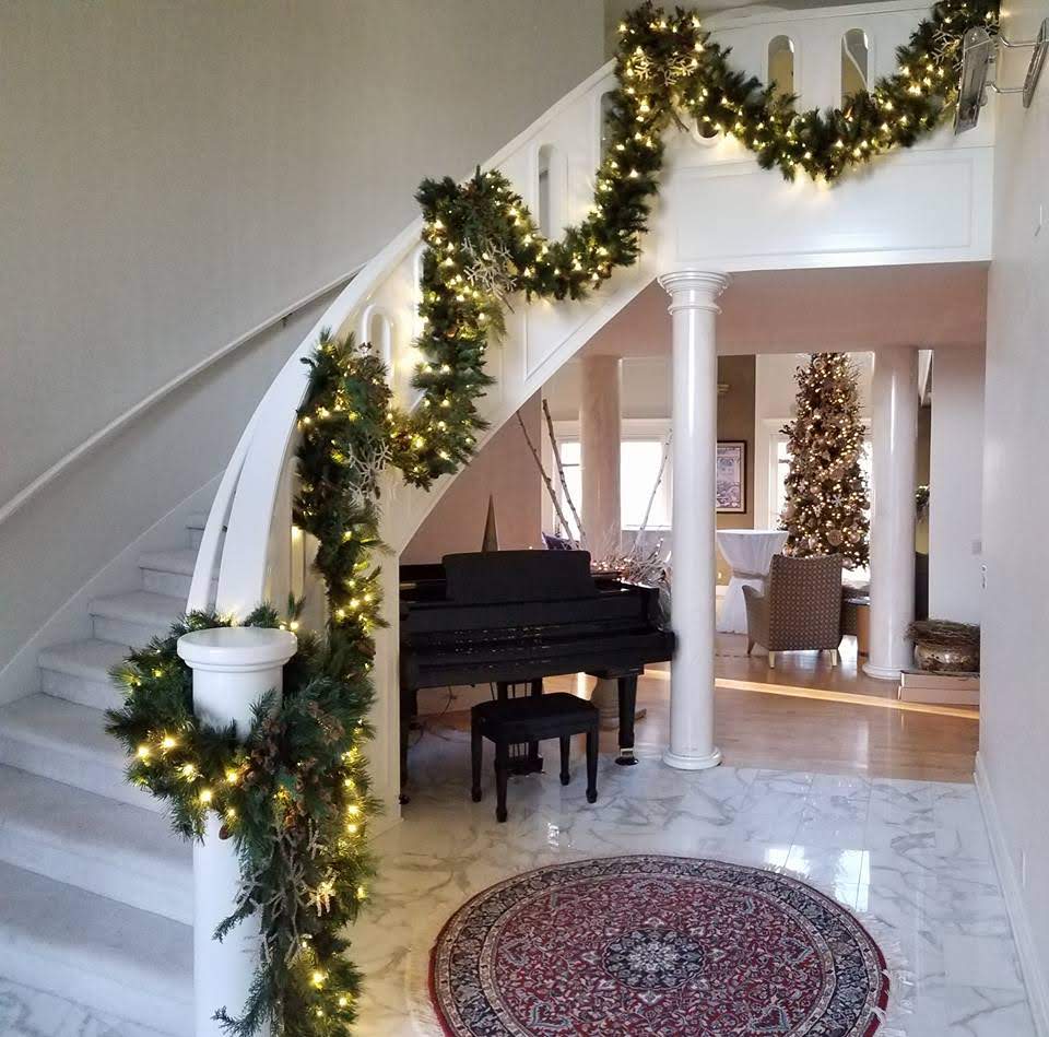 foyer with holiday lighting