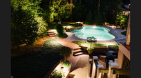 Patio and pool with outdoor lights