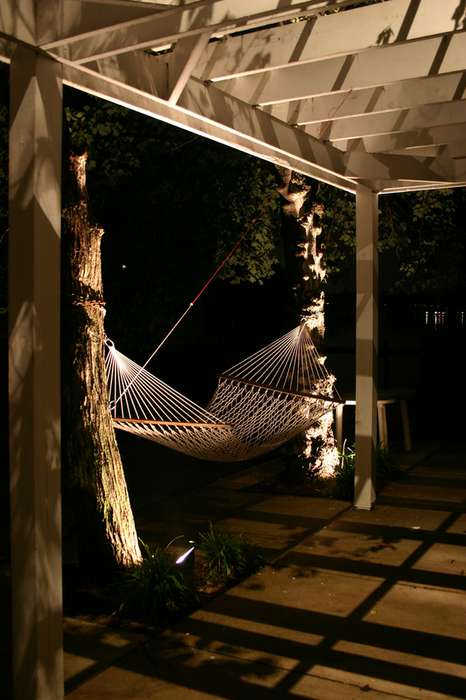 Patio with hammock and outdoor lighting
