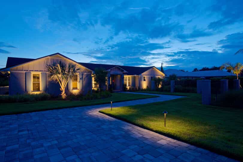 Home and landscape illuminated by customized uplighting 