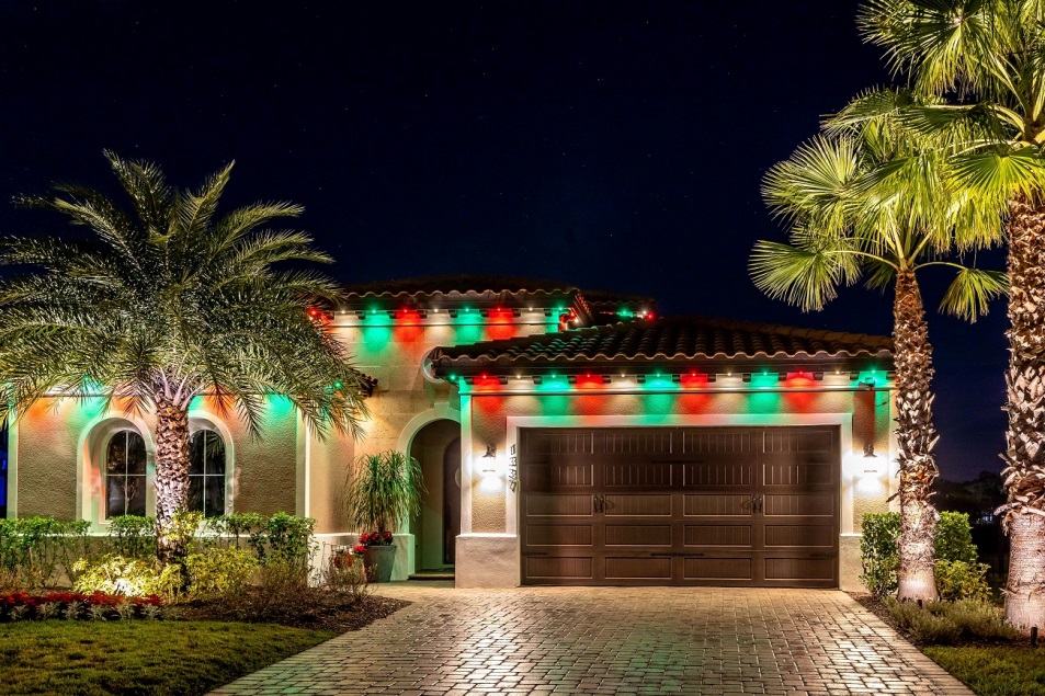 green, red, and white lights on roofline on Florida home