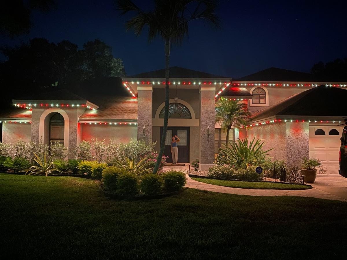 red and white led colored roofline lights on a home in Florida