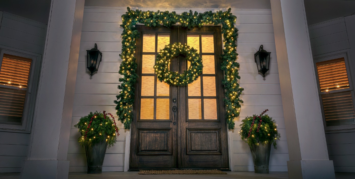 front door with wreath and garland