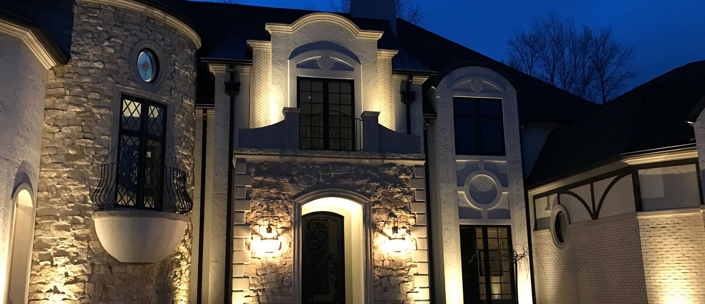 front entry way architectural lighting on a stone house