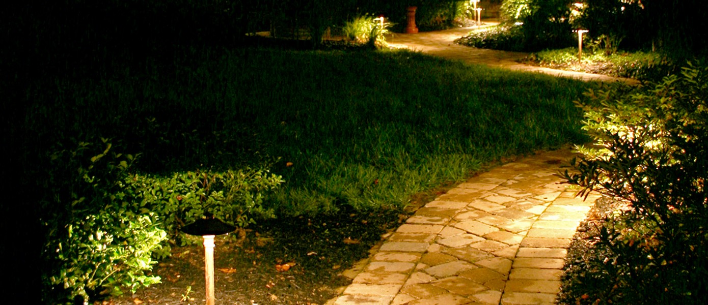 close up of paver walkway with outdoor lighting