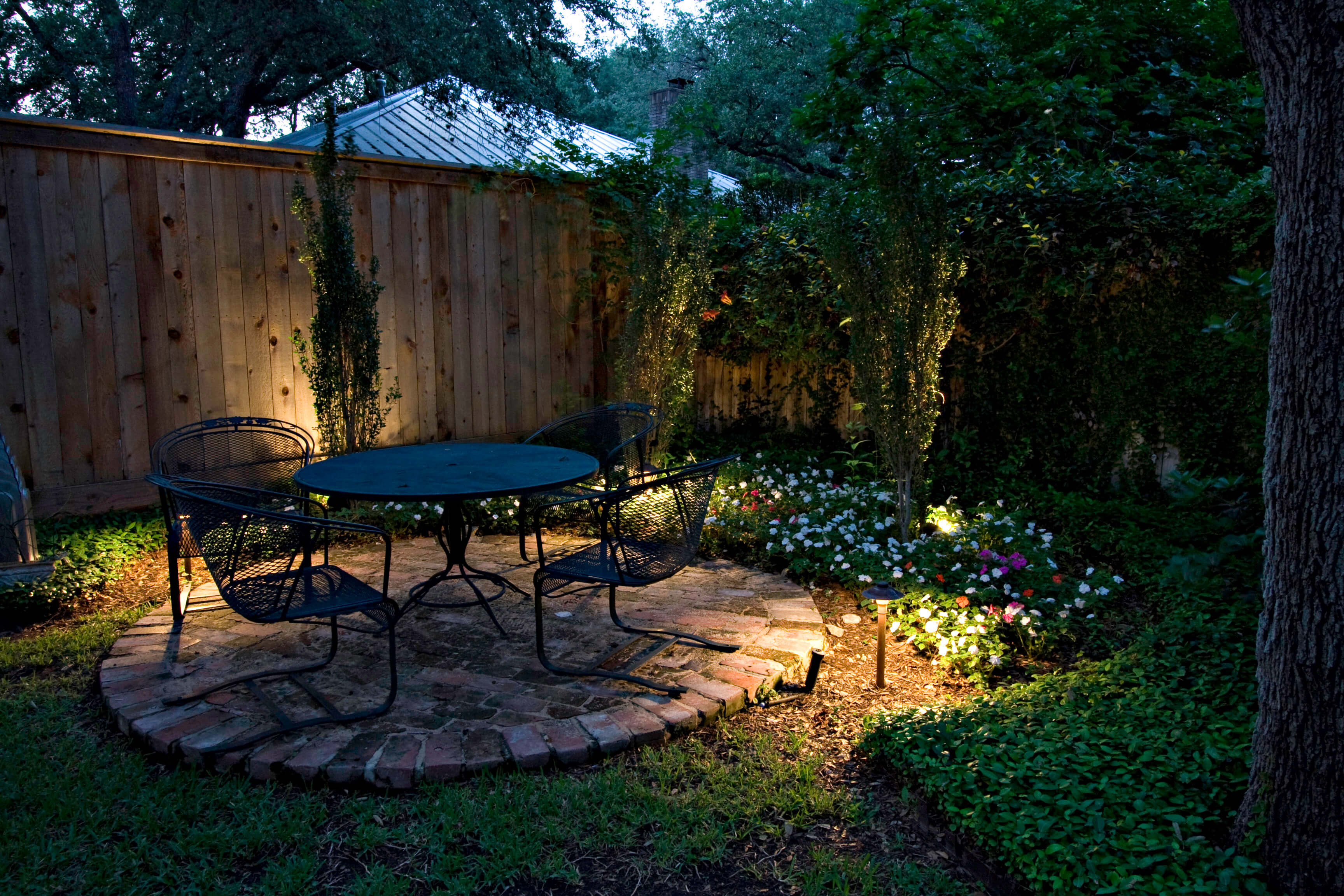 Small outdoor patio area with bistro style table and chairs