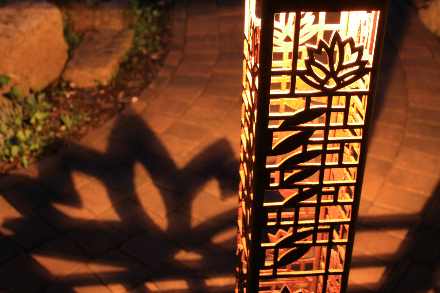decorative lantern lighting on brick pathway in woodinville
