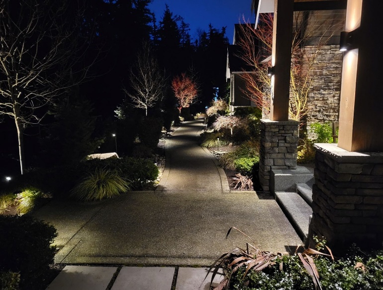 A walkway with lights on