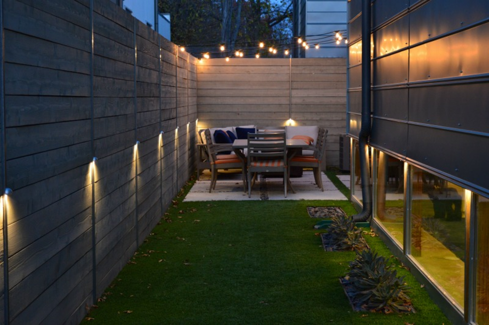 modern backyard lighting with table