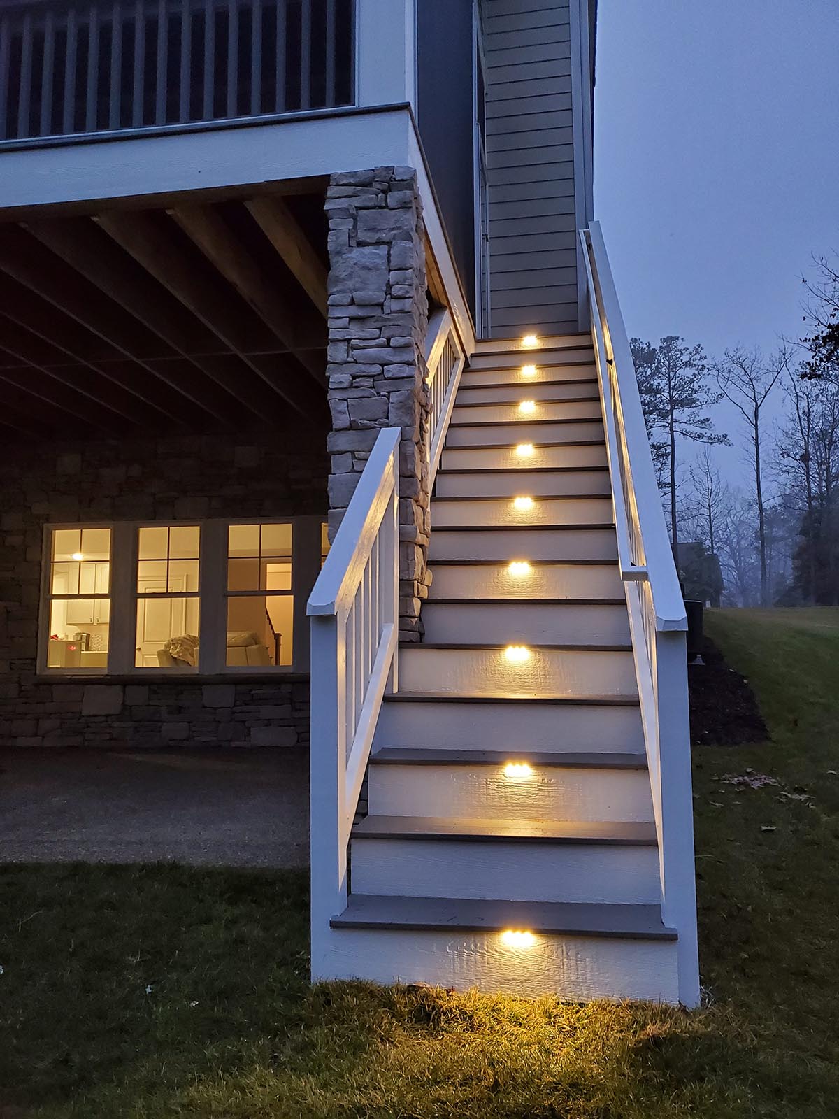 residential backyard staircase with illumination lighting on the stairs 