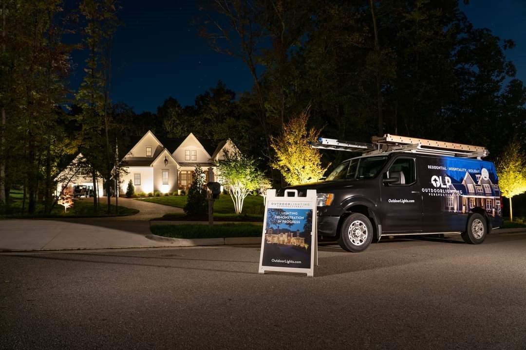 outdoor lighting perspectives service van in front of house