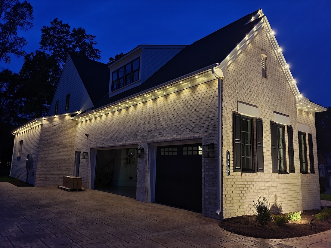 Bon Air home garage with permanent roofline lighting