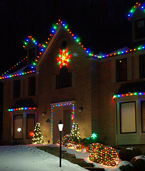 charlotte colorful christmas lighting on house and bushes