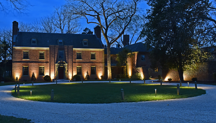 brick building with exterior lights and driveway lighting in charlotte