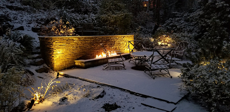 LED Lights in snow-covered Backyard