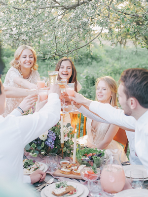 family having a garden party toasting their glasses