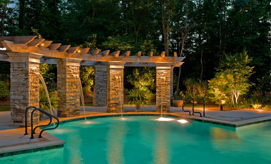 Pool with a special water fountain feature with special lighting