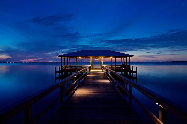 dock on a lake with lighting