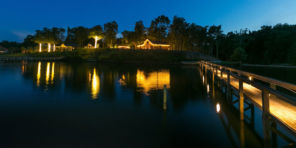 Dock with lighting and view of homes 