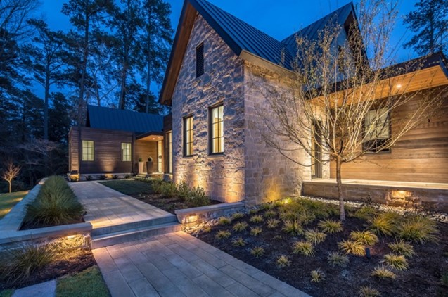 brick home with pathway lights garden lights and exterior lighting in everett