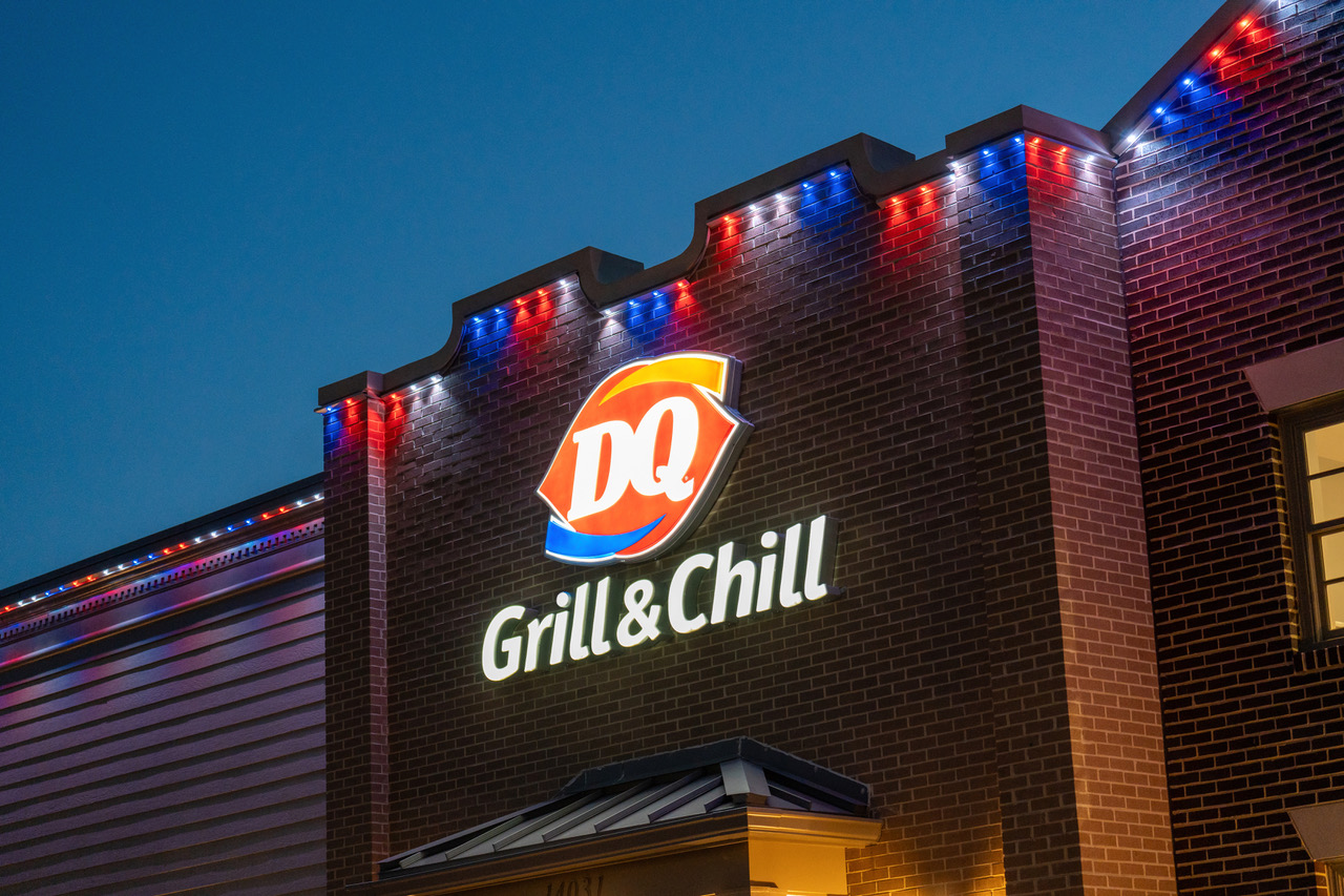 Commercial restaurant with permanent roofline lighting set to red, white, and blue for the 4th of July