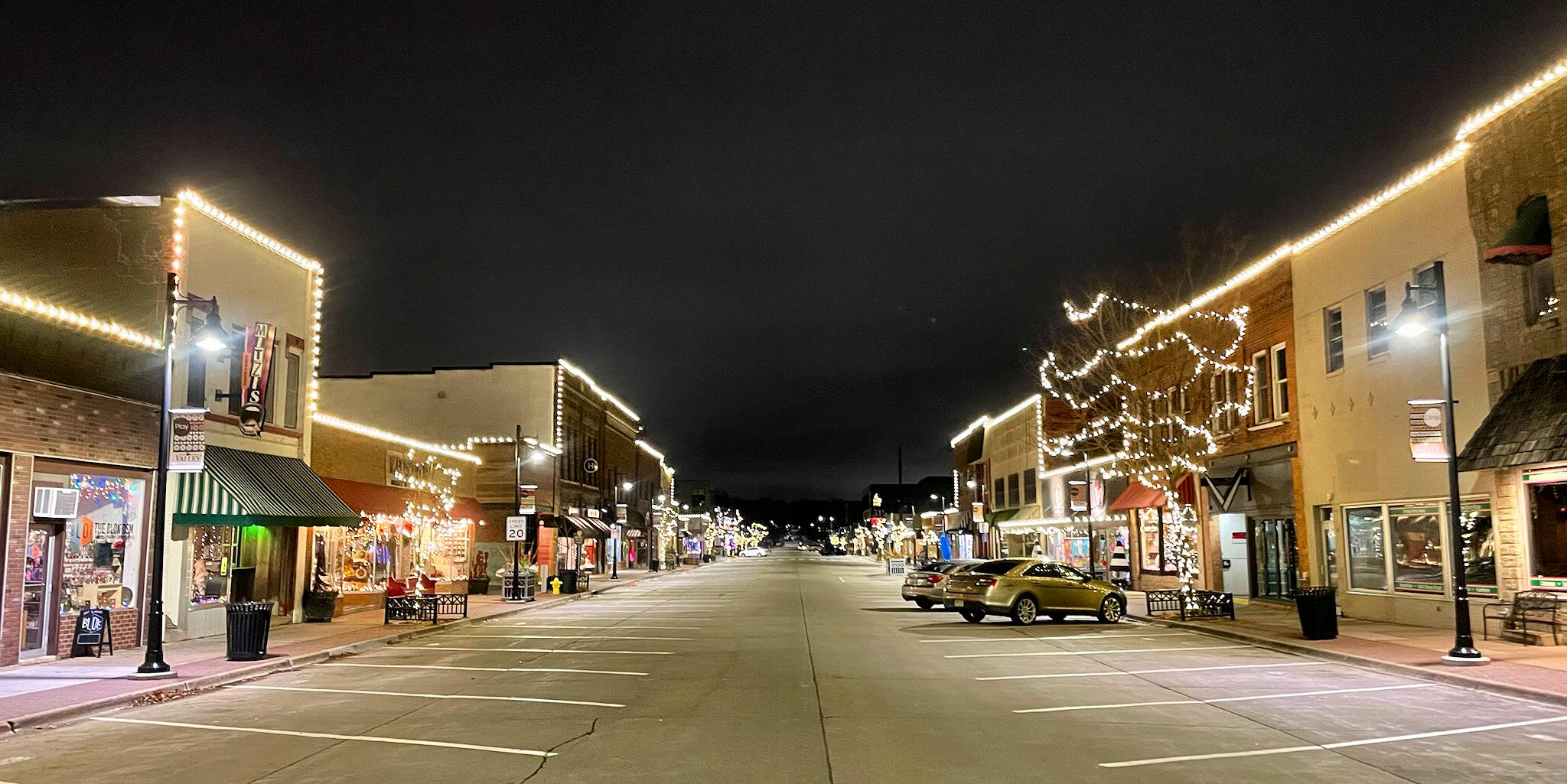 Holiday lighting and décor throughout a commercial shopping district