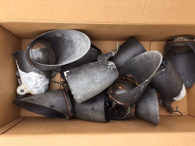 a box of removed outdoor lights