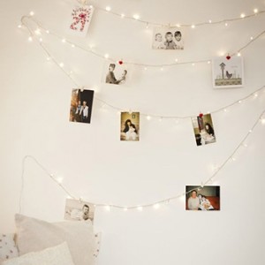 photos pinned to string lights