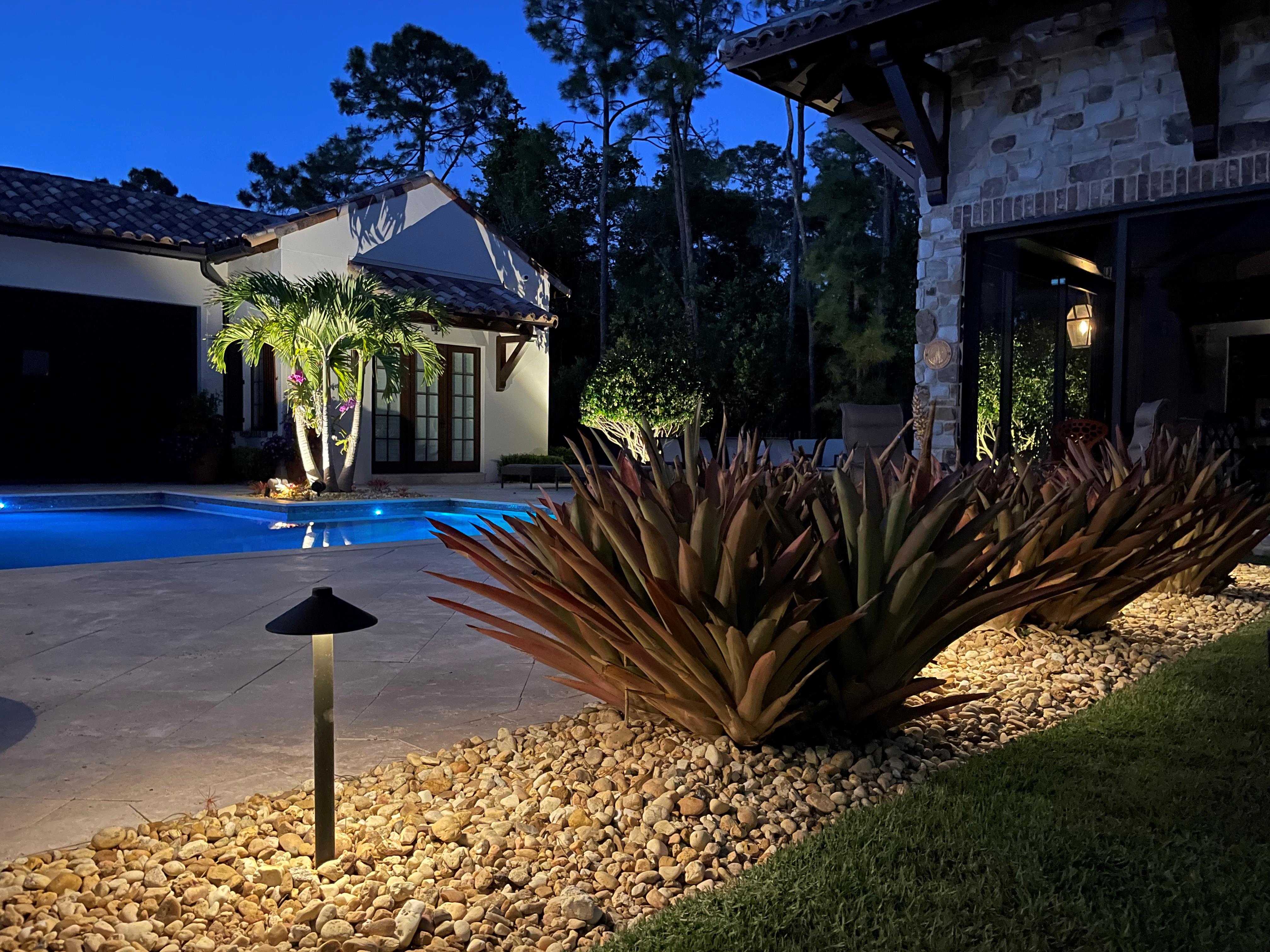 backyard with landscaping lights 